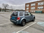 2011 Ford Escape XLT FWD parked in a lot, featuring new all-season tires and a sunroof.