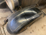 Close-up of a 1928 Dodge Brothers sedan's rear fender, showcasing its vintage design and condition.