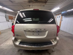 Rear view of a 2013 Dodge Grand Caravan with FWD, featuring a clean design and tinted windows.