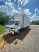 1993 Chevy Tiltmaster Van Box Truck with 18ft van body parked on gravel under a cloudy sky.
