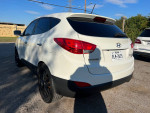 Side view of a 2011 Hyundai Tucson with leather interior and clean title for sale