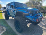 Upgraded Hydro Blue Jeep Rubicon 392 with 135,000 miles, garage kept, low miles, never off-roaded.