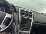 Interior view of a 2009 GMC Acadia showing dashboard and controls, available for sale.