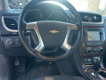 Interior view of a 2013 Chevrolet Traverse LT AWD with visible controls and dashboard features.