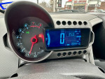 Dashboard of a 2013 Chevrolet Sonic LT showing speedometer and odometer readings.