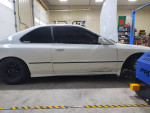 1994 Honda Accord coupe project car with aftermarket parts, located in a garage setting.