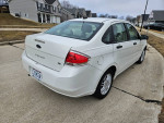 2011 Ford Focus S in excellent condition with low mileage parked on a suburban street.