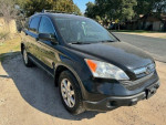 2007 Honda CR-V EX FWD in black, showcasing exterior design and features from the front view
