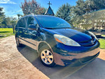 2006 Toyota Sienna LE minivan with leather seats and front wheel drive parked outdoors