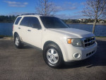 2009 Ford Escape XLT FWD in white, excellent condition, low mileage, located near a lake.