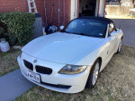 2006 BMW Z4 convertible with 85,000 miles, clean white exterior, parked in a garage.