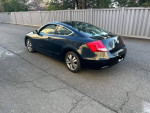 2008 Honda Accord LX coupe with low mileage parked on the street, showcasing its sleek design and well-maintained exterior.