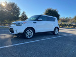 2019 Kia Soul in white parked with black interior, equipped with backup camera and fog lights.