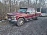 1996 Chevrolet Silverado 1500 with new battery and remote start, parked in wooded area