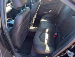 Interior view of a well-maintained 2012 Cadillac CTS showcasing clean black leather seats.
