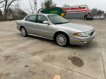 2004 Buick LeSabre Custom in silver, well-maintained, low mileage, parked outside on a clean surface.