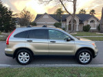 2007 Honda CR-V in excellent condition with 72,000 miles, parked on a street during sunset.
