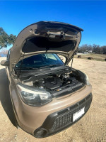 2016 Kia Soul in excellent condition with hood open, showing clean engine compartment and well-maintained features.
