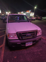 2011 Ford Ranger XL truck parked at night, showcasing a clean body and clear headlights with visible license plate.