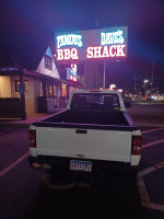 2011 Ford Ranger XL RWD parked near Famous Dave's BBQ Shack at night, showcasing its clean body and bed cover.