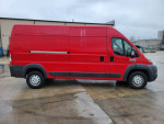 2015 Ram Promaster 2500 high roof van in red, showcasing its side view and fleet maintenance history.
