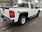 2011 Chevrolet Silverado 1500 LTZ 4WD, white crew cab, showing exterior design and features.