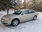 2012 Chevrolet Impala LT parked in the snow, showing good condition and recent maintenance with new tires and brakes.