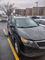 2013 Kia Sorento for sale, showing exterior with rain, suitable for mechanics, 108,000 miles