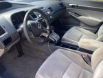 Interior view of a 2008 Honda Civic EX showing dashboard and seating, well-maintained with functional features.