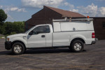 2008 Ford F150 commercial truck with cap, ideal for contractors and small businesses, showing reliable design and spacious storage.