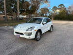 2013 Porsche Cayenne in white, excellent condition, fully loaded with navigation, sunroof, and backup camera.