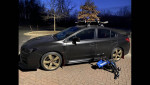2015 Subaru WRX Limited AWD parked with ski rack, shadow black dipped finish, and summer tires.