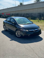 2011 Honda Civic in black with 67,000 miles, featuring new brake pads, a modern radio, and minor scratches.