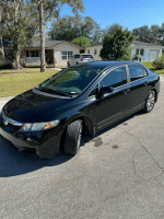 2011 Honda Civic in black parked on the street, featuring new engine mounts and A/C system.
