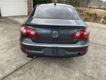 Rear view of a 2012 Volkswagen CC R-Line parked, showcasing its sleek design and clean title features.