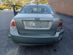 2009 Ford Fusion with dent in back, available for test drive. Clean title, good condition, ideal for commuting.