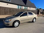 2007 Toyota Corolla SE in tan color parked on the street, well-maintained with 139,000 miles.