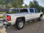 2018 GMC Sierra SLT Crew Cab 3500 HD in immaculate condition, 69,000 miles, parked on driveway.