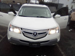2008 Acura MDX SUV with 3rd row seats, inspected, featuring premium sound and navigation system.