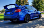 2017 Subaru WRX Limited in World Rally Blue parked on a sunny day showcasing stylish design and sporty features.