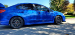 2017 Subaru WRX Limited AWD in World Rally Blue, showcasing stylish design and sporty features.