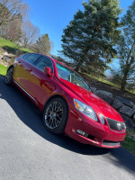 2006 Lexus GS 430 in Matador Red Mica parked outdoors, featuring G Spyder alloy wheels and a clean, rust-free exterior.
