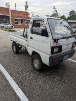 1989 Mazda Scrum 4x4 KEI truck parked with modifications for off-road fun and daily errands.