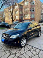 2009 Volkswagen Tiguan SE 4Motion AWD parked on the street with clean title and low mileage.