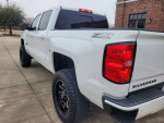 2018 Chevrolet Silverado 1500 Z71 LT 4WD in great condition, featuring a lifted exterior and stylish wheels.