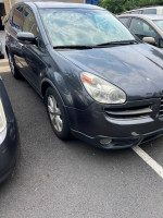2007 Subaru Tribeca B9 AWD parked, showing signs of wear and needing mechanical attention.