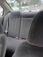 Gray backseat of a Chevrolet, spacious and well-maintained, showing no signs of wear.