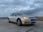 2011 Chevrolet Malibu LT sedan in silver, showcasing its stylish design and clean condition, parked outdoors