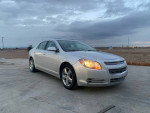 2011 Chevrolet Malibu LT sedan with leather interior and sunroof, 82,000 miles, parked outdoors