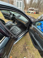 Interior view of a Mercedes-Benz with leather seats and modern features, showcasing comfort and style.
